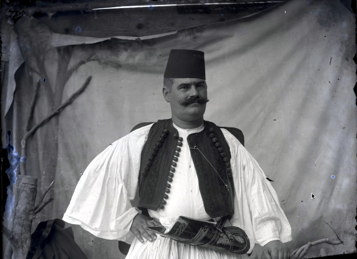 Vlach from the village Syrrako, near Ioannina in Greece, dressed in Vlach folk costume. In Manaki's atelier in Ioannina. 1900